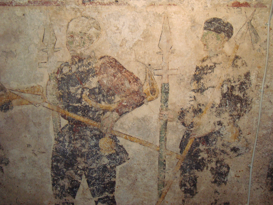 Die Gruppe stellt einen Ausschnitt aus einem großen Fresko dar, vermutlich einen Umzug von Jägern